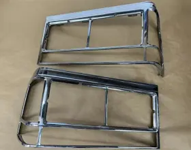 1628787 Cadillac 80-89 Deville Fleetwood Headlight Light Lamp Trim Bezels Pair