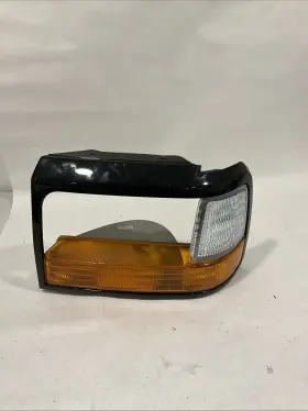 02hgl1244asl-l Ford 1992-1997 F-250 Headlight Turn Signal Bezel Tested Oem