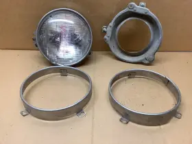 5955770 General Motors 1961-64 Corvair 5.5 Inch Headlight Unit Assembly Back Bracket And 2 Trim Rings 3 Tab
