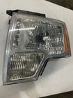 2112 Ford F-150 Halogen Headlight (left/driver) CL34-13006B Oem Used. Price: $69.00.