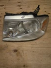 2004-2008 Ford F150 Headlight Assembly Driver Left Hand Lh Chrome Background Used. Price: $30.00.