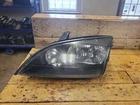 05-07 Ford Focus Left Front Driver Side Head Light Lamp Halogen Lh Used. Price: $102.90.