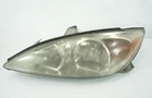 2002-2004 Toyota Camry Xle Halogen Headlight Driver Left Oem Used. Price: $44.99.