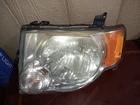 Passenger Left Headlight Clear Background Fits 08-12 Escape 9L84-13006A Used. Price: $50.00.