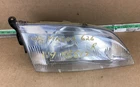 1998-1999 Mazda 626 Front Right Passenger Side Headlight Assembly. Used. Price: $62.99.