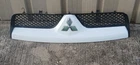 06 07 08 09 Mitsubishi Raider Front Bumper Cover Hood Upper Top Grille Red Used. Price: $120.00.