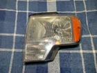 Genuine Ford AL3J-13006-A Left Headlight Housing Used. Price: $39.15.