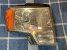 Genuine Ford AL3J-13005-A Right Headlight Housing Used. Price: $39.15.
