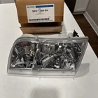 New Oem 2005 Ford Crown Victoria Front Left Headlight Lamp 5W7Z-13008-BA. Price: $73.50.