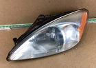 2000-2007 Ford Taurus Front Left Driver Side Headlight YF12-13006-A Oem. Used. Price: $99.99.