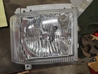 98241335 Headlight New. Price: $280.00.