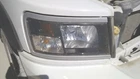 Passenger Headlight Black Bezel With Silver Trim Fits 08-11 Dakota 5382134 Used. Price: $100.00.