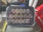 Single Piece 7X6" Led Black Headlight JG-1003 New. Price: $19.35.