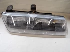 Saturn Series 1991-1996 Coupe Fixed Composite Passenger Headlight Assembly Used. Price: $75.00.