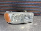 1999-2007 Gmc Sierra Yukon Passenger Right Headlight Housing + Bracket Used. Price: $50.00.