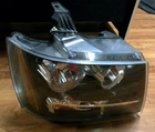 2007-2014 Chevy Avalanche Tahoe Right Headlight Oem# 6002TA0054 Damaged Tabs Used. Price: $70.00.