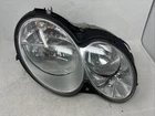 Passenger Headlight 209 Type CLK350 Halogen Fits 03-06 Mercedes Used. Price: $98.39.