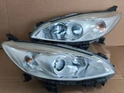 Jdm Premacy 12-14 Front Halogen Head Lights Lamps Pairs Used. Price: $219.99.