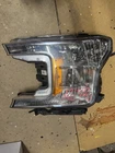 Genuine 2017-2019 Left Side Headlight Ford F150 Clear Lens JL34-13006-AH Used. Price: $500.00.