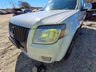 Used Left Headlight Assembly Fits: 2010 Mercury Mariner Grade. Price: $117.45.