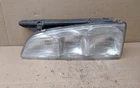1992 Pontiac Trans Sport Left Side Headlight Glass W/ Bracket Used. Price: $60.00.