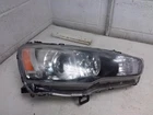 2008 Mitsubishi Lancermit Oem Xenon Headlight Passenger Side W/module Dingy Lens Used. Price: $399.95.