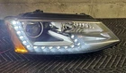 2013-16 Volkswagen Jetta Hybrid Genuine Right (passenger) Bi-xenon Headlight Used. Price: $699.99.