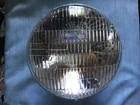 Military 24 Volt Headlight 7 Inch Sealed Beam, Wagner Mfg New. Price: $34.50.