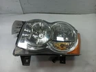 Driver Left Headlight From 2010 Jeep Grand Cherokee 11944891 Used. Price: $121.94.