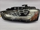 Audi A4 Xenon Lamp Left Drivers 8K0941005E Used. Price: $200.00.