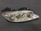 04 05 06 07 Mazda Front Right Passenger Headlight F014003909R Oem 01HGHRFIP Used. Price: $200.00.