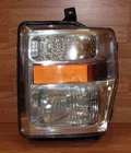 *replacement* Genuine Ford (7C34-13006-A) Left Handed / Driver Side Headlight Used. Price: $112.08.