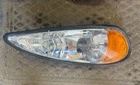 99-05 Pontiac Grand Front Right Passenger Side Headlight Lamp Oem, 114-02683R Used. Price: $40.00.