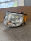 2011 Ford Escape Driver Side Headlight SAE-HRAP15P2-08EE Used. Price: $40.00.