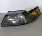 1999-2004 Ford Mustang Headlight Assembly Left Drivers Side Used. Price: $30.00.