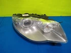 Vw Touareg 2007-10 Xenon Right Passenger Headlight 7L6941032D W/mounting Bracket Used. Price: $349.85.