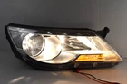 Oem 2009-11 Volkswagen Tiguan Right Passenger Side Halogen Head Light Assembly Used. Price: $102.45.