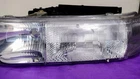 Left Headlight Oem 16524535/ 1999-02 Silverado, Tahoe, Suburban, Gmc Sierra Used. Price: $60.00.