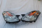 08-09 Nissan Altima 3.5 Coupe Xenon Lamps Set L&r Polished Used. Price: $423.69.