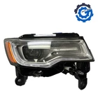 New Oem Mopar Headlight Lamp Right For 2017-2018 Jeep Grand Cherokee 68266660AI. Price: $1740.00.
